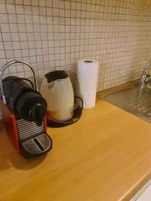 a kitchen counter with a toaster on a counter top at Cute Apartment Next To Acropolis Museum in Athens
