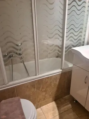a bathroom with a shower and a toilet at Cute Apartment Next To Acropolis Museum in Athens