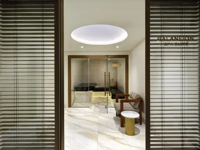 a lobby with a glass door leading to a living room at Anthology of Athens, The Leading Hotels of the World in Athens
