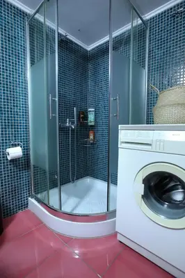 a washing machine in a bathroom with a shower at Modern 2BD apartment next to Acropolis in Athens