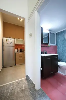 a kitchen with a sink and a refrigerator at Modern 2BD apartment next to Acropolis in Athens