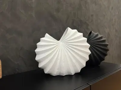 a white paper umbrella sculpture sitting on top of a counter at Acropolis Signature Apartment in Athens