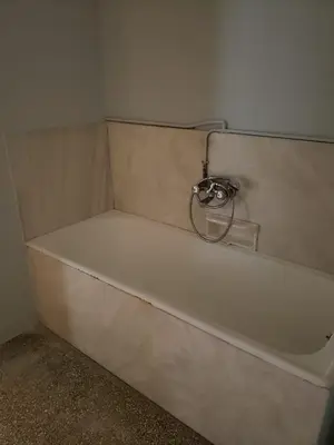 a white bath tub sitting in a room at Relax & Enjoy in Athens