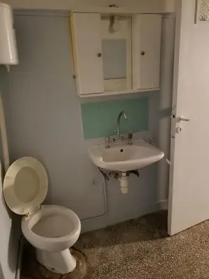 a bathroom with a toilet and a sink at Relax & Enjoy in Athens