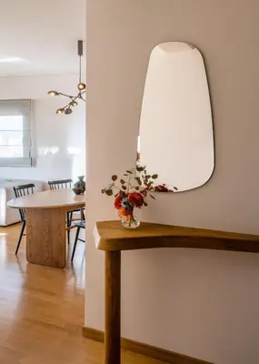 a room with a table with a mirror on the wall at Athenian Songs - 3BR Penthouse with Acropolis Views in Athens