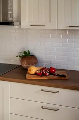 a cutting board with fruits and vegetables on a kitchen counter at Athenian Songs - 3BR Penthouse with Acropolis Views in Athens