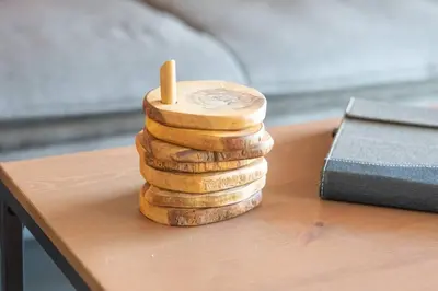 a stack of logs sitting on top of a table at The HostMaster Ethnic Touch Feel Studio in Athens