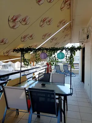 a dining room with tables and chairs in a restaurant at Myilios Leisure Piraeus by Ilios Company in Piraeus
