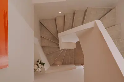 a spiral staircase in a house at Luxury Penthouse Maisonette Nearby Acropolis in Athens