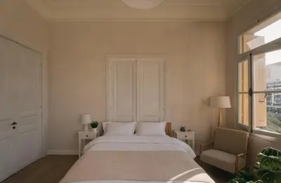 a bedroom with a bed and a chair and a window at Casa Tao in Athens