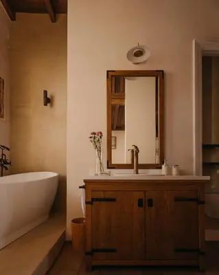 a bathroom with a tub and a sink and a mirror at Casa Tao in Athens
