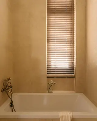 a white bath tub in a bathroom with a window at Casa Tao in Athens