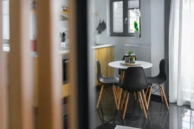 a small kitchen with a table and chairs at The HostMaster Roofgarden Urban Bliss in Athens