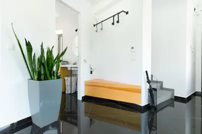 a bathroom with a tub and a sink and a mirror at The HostMaster Roofgarden Urban Bliss in Athens