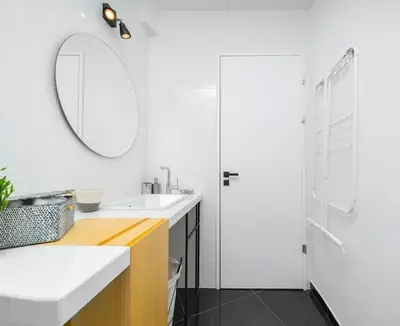 a white bathroom with a sink and a mirror at The HostMaster Roofgarden Urban Bliss in Athens