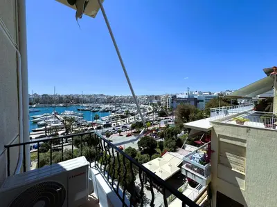 a balcony with a view of a marina at Piraeus center sea view apartment in Piraeus