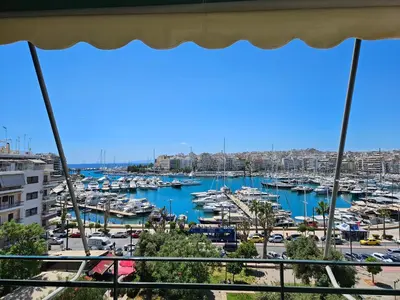 a view of a marina from a balcony at Piraeus center sea view apartment in Piraeus