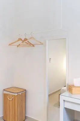 a room with a closet with a hanger on the wall at The HostMaster Ethereal Scene in Athens