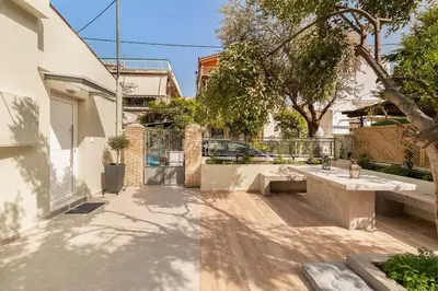 a courtyard with a sink in a house at The HostMaster Aethereal Style in Athens