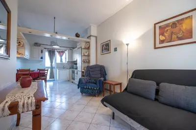 a living room with a couch and a table at N kosmos metro st 1 bedroom 4 pers flat by MPS in Athens