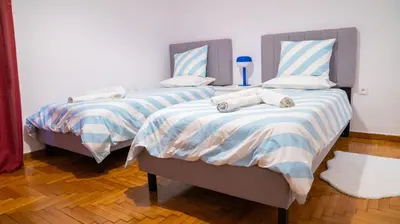 two beds sitting next to each other in a room at Cozy Apartment in Athens Center in Athens