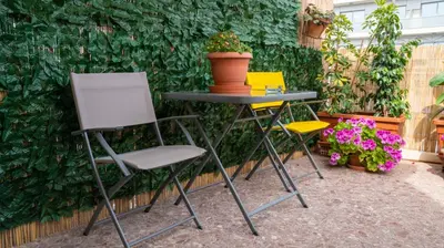 a table and two chairs and a table with a plant at Cozy Apartment in Athens Center in Athens