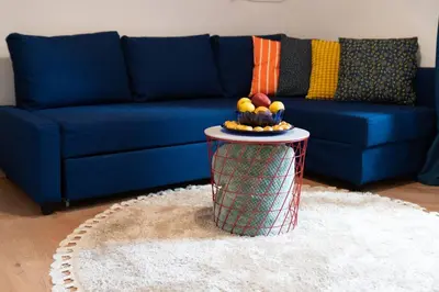 a blue couch with a table in a living room at Cozy Apartment in Athens Center in Athens