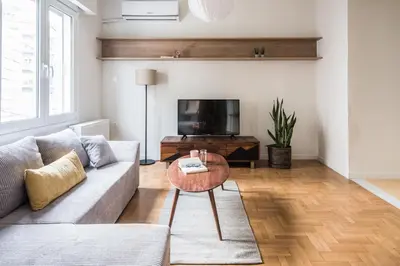 a living room with a couch and a table at Athens Secret Gem in Athens