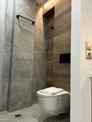 a bathroom with a toilet and a shower at Stylish Living-Avra in Athens