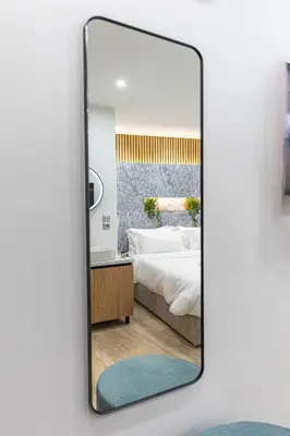 a mirror in a bedroom with a bed at Stylish Living-Avra in Athens