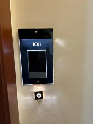 a monitor on a wall in a hotel room at Stylish Living-Ioli in Athens