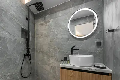 a bathroom with a sink and a mirror at Stylish Living-Ioli in Athens