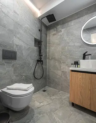 a bathroom with a shower and a toilet and a sink at Stylish Living-Ioli in Athens