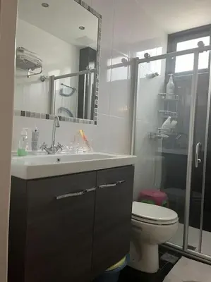 a bathroom with a toilet and a sink and a shower at Διαμέρισμα στην Άνω Ηλιούπολη in Athens