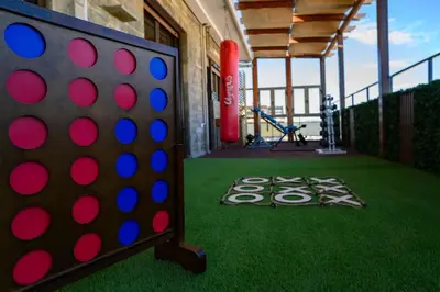 a large board game on a green floor in a gym at Exclusive 2 bed Luxury Panorama in Athens