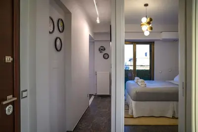 a room with a bed and a room with a hallway at Exclusive 2 bed Luxury Panorama in Athens