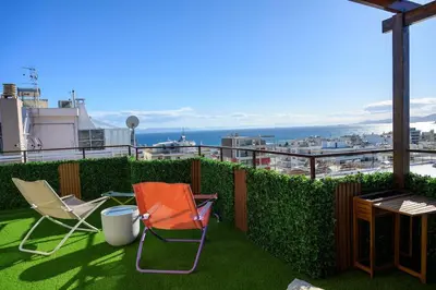 two chairs and a table on a balcony at Exclusive 2 bed Luxury Panorama in Athens