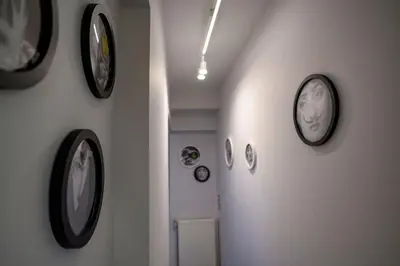 a hallway with several clocks on the wall at Exclusive 2 bed Luxury Panorama in Athens