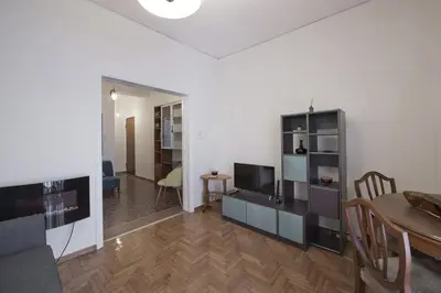 a living room with a table and a dining room at Alemar Quiet Kallithea Retreat with AC, Wifi in Athens