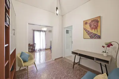 a living room with a desk and a chair at Alemar Quiet Kallithea Retreat with AC, Wifi in Athens