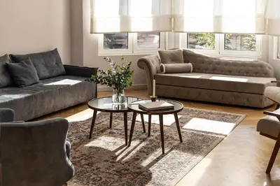 a living room with a couch and a table at Kolonaki Chic Haven - A Downtown Retreat in Athens