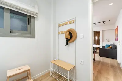 a white room with a hat on the wall at Alkis Luxury By Greece Apartments in Athens