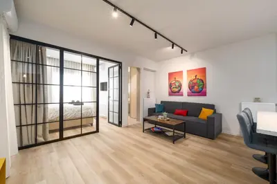a living room with a couch and a table at Alkis Luxury By Greece Apartments in Athens