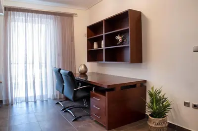 a home office with a desk and a chair at Cozy flat in Elliniko - 300Mbps Wi-Fi in Athens