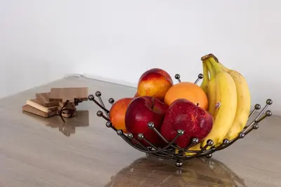 a bowl of fruit sitting on a table at Cozy flat in Elliniko - 300Mbps Wi-Fi in Athens