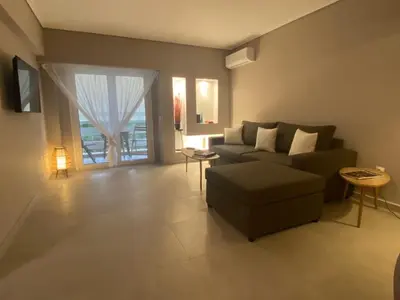 a living room with a couch and a table at Miliannas in Athens