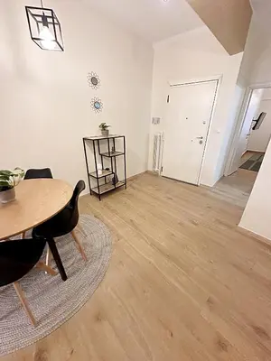 an empty living room with a table and a dining room at Check Point - Athens Heart in Athens