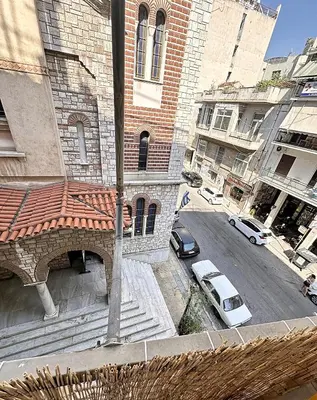 an overhead view of a building with cars parked on the street at Check Point - Athens Heart in Athens