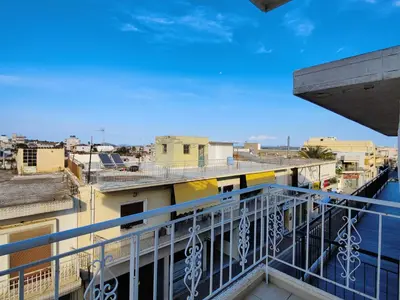 a view of a city from a balcony at Finikas Spata Holiday Apartment in Spáta