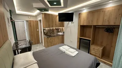a room with a table with two towels on it at Luxury Semi Basement Apartment with Terrace in Athens